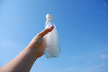 hand holding a bottle