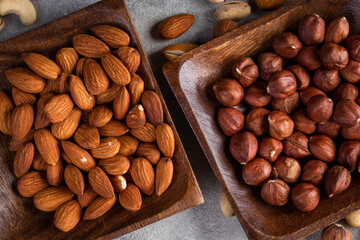 Cashew, almond, peanut, walnut nuts in a wooden bowl.
