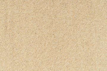 Fototapeta na wymiar Sand beach texture background. Light hot sand on the sea coast in summer.
