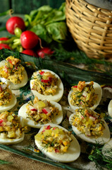 Stuffed eggs with dill and radish