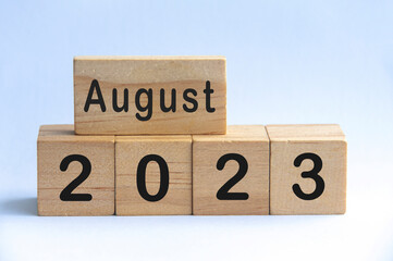 August 2023 text on wooden blocks with white color background. Copy space