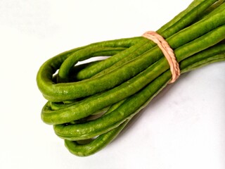 green beans on a wooden background