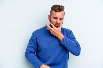 Young caucasian man isolated on blue background having a strong teeth pain, molar ache.