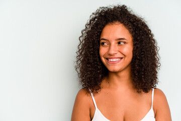 Young Brazilian woman isolated on blue background