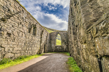 Fototapeta na wymiar Ruins of the medieval Magnus cathedral in Kirkjubour at the Faroe Islands