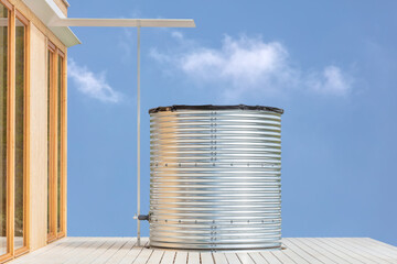 Modern large home water tank for collecting and storing rainwater - obrazy, fototapety, plakaty