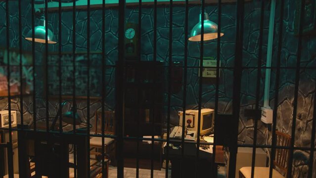Dark jail cell at night . Hanging Swaying swinging lamps on dark room . Scary , mystic place . Prison life concept . Shot on camera ARRI slow motion