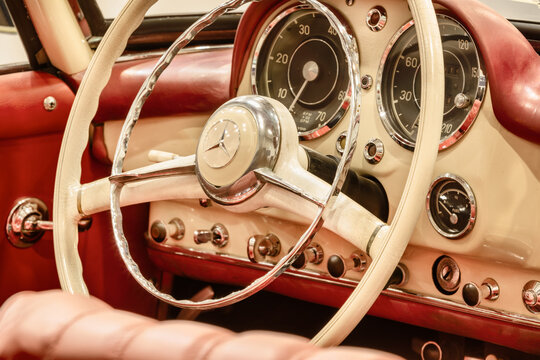 Interior of a classic red Mercedes 300 SL convertible car in Essen, Germany on March 23, 2022