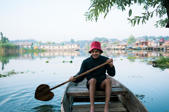 Person on a boat, Beautiful nature of Dal Lake, Kashmir, India.