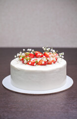 Strawberry homemade cake decorated with gypsophila sprigs