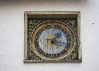 Fototapeta na wymiar Clock on the Church of the Holy Spirit in Tallinn, Estonia