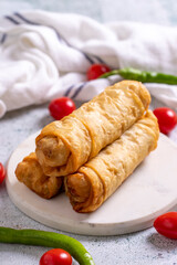 Pacanga pastry. Turkish Pacanga Boregi with pastirma (pastrami) and cheddar cheese. Traditional Turkish cuisine delicacies. close up