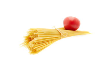 Raw spaghetti and red tomato isolated one white background.