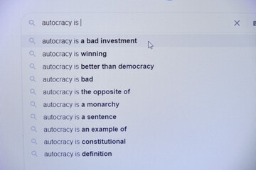 autocracy concept, search for the meaning of the word on the Internet, computer monitor close-up