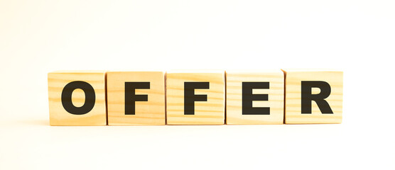 The word OFFER. Wooden cubes with letters isolated on white background.