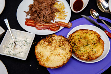 The process of making a burger in a restaurant kitchen. Close-up of fried buns.