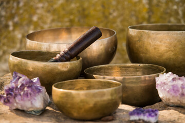Still life with Tibetan bowls on rocks.