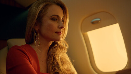 Successful ceo talking virtual meeting closeup. Wealthy blonde dreaming on jet