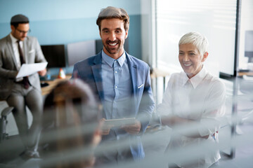 Collaboration and analysis by business people working in office