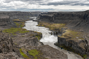 Aerial view of the waterfall Hafragilsfoss and the surrounding canyon Jokulsargljufur seen from the east bank of river Jokulsa a Fjollum, in northern Iceland