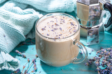 Cup of cappuccino raf coffee with lavender syrup. Aromatic lavandula infused latte coffee hot drink...