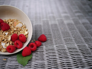 Granola and raspberries for a healthy breakfast 