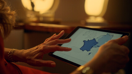 Closeup hands touching tablet computer screen. Business lady working on aircraft