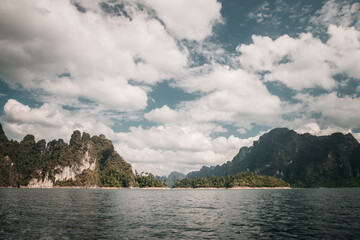Khao Sok, Thailand - December 20th, 2019 : cliffs on the banks of the lake in the Thai national park of Khao Sok