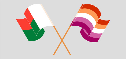 Crossed and waving flags of Madagascar and Lesbian Pride