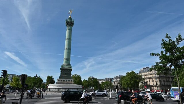 France, Paris, June 2022. Place de la Bastille, highlighted the column of Juillet, in memory of the revolution of 1830. The golden winged statue stands out on the top. Static frame.
