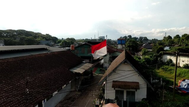 red and white flag flying on pole in front of government office, bendera merah putih nasional indonesia