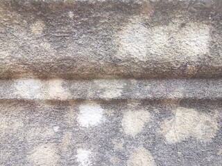 Old weathered and marked grey grungy wall with copy space