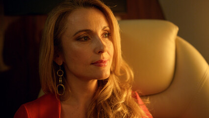 Fototapeta premium Pensive lady looking distance in sunlight closeup. Gorgeous businesswoman relax