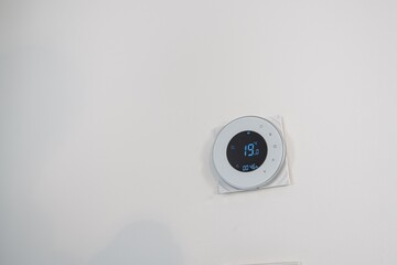 Temperature regulator for air conditioning and heating on the wall in a new apartment