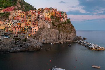 Fototapeta na wymiar Manarola in 5 Terre, beautiful little town in Italy during sunset. Popular and famous tourist destination in Italy