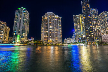 Fototapeta na wymiar Miami River Night Water Reflections Apartment Buildings Downtown Miami Florida