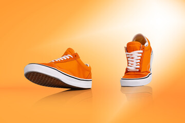 Modern unisex footwear, sneakers isolated on orange background. Fashionable stylish sports casual...