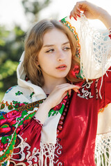 Portrait of a beautiful blonde in traditional national clothes.