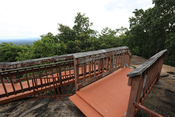 Fototapeta na wymiar Background of wooden walkways (wooden bridges) created for high-angle views on mountains, natural attractions, or parks that have forest preservation