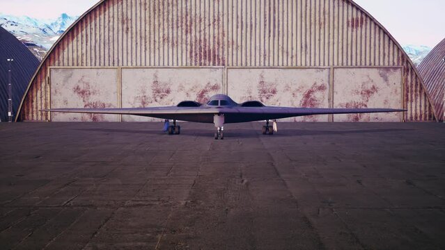 Stealth bomber b2 Spirit near hangar on military base