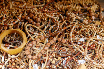 Selective focus, pile of tribal necklaces on display at Camden market in London