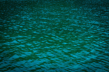 Rippling green water surface, water river for background