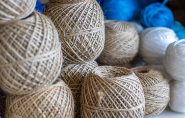 spools of thread on shelf for sale in industrial store,shop,market.jute twine natural twisted rope...