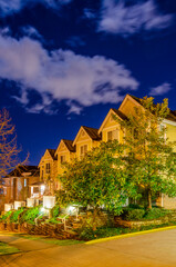 Fototapeta na wymiar Luxury house with big tree and nice landscape at night in Vancouver, Canada, North America. Night time on May 2022