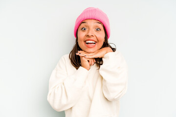 Young hispanic woman isolated on blue background showing a disappointment gesture with forefinger.