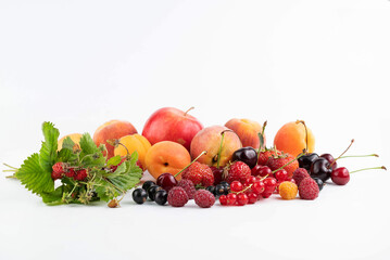 Ripe fruits and berries on a white background.