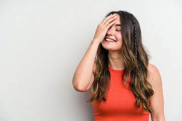Fototapeta premium Young caucasian woman isolated on white background laughing happy, carefree, natural emotion.