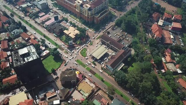 Birds eye view of Acacia Mall shopping centre and city buildings in Kampala, urban scene from Uganda.