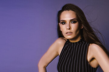 Fashion portrait of a brunette with long hair and 90s style makeup through a crystal filter,...