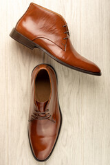 chelsea boots seen from above on white wood